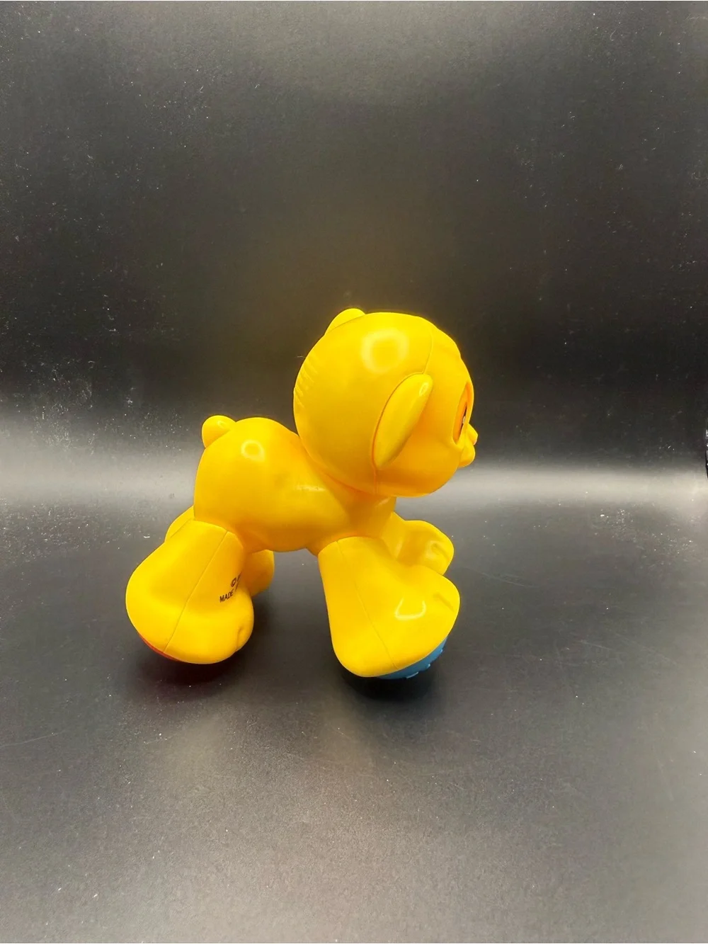 Fisher-Price Bright Yellow Lion Push Toy with Blue Wheels